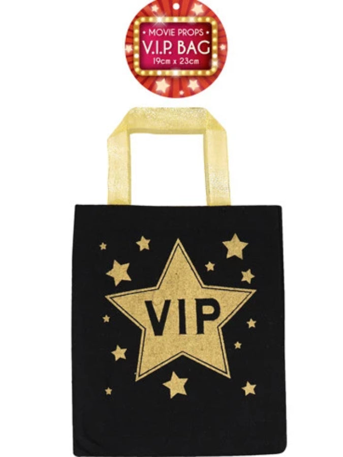 black bag gold handles VIP printed in centre of bag
