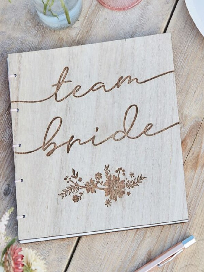Rustic wood paired Hen Party Guest Book with the pink ribbon has 32 pages and Tram Bride script on the cover 