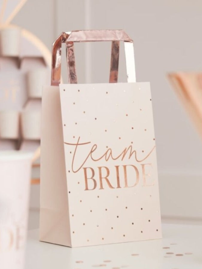 5 blush pink and rose gold foiled hen party bags with rose gold Team Bride foil text