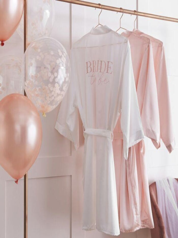 Embroidered pink with Bride To be at the back this robe ties at the waist with a self-fabric belt