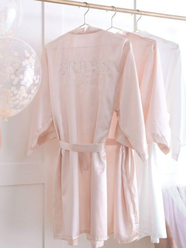 pink dressing gown with Embroidered white with Brides Besties at the back