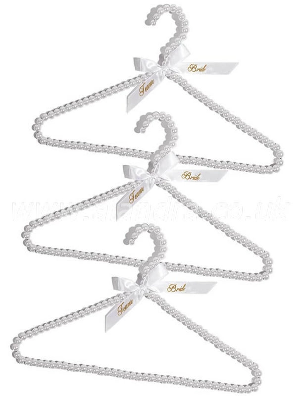 3 Pieces of White  Pearl Beaded Hangers with a  White Ribbon Bow with Foil Gold Printing and the Words 'Team Bride' on Both Ribbon Tails  