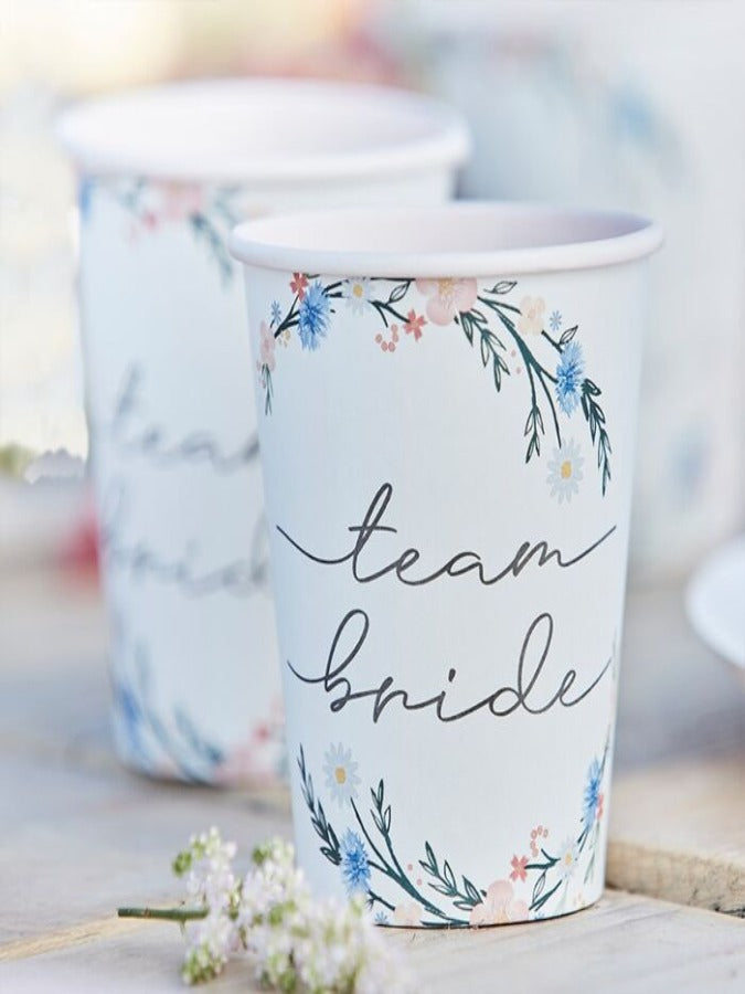 8 white cups with meadow inspired floral pattern and Team bride script