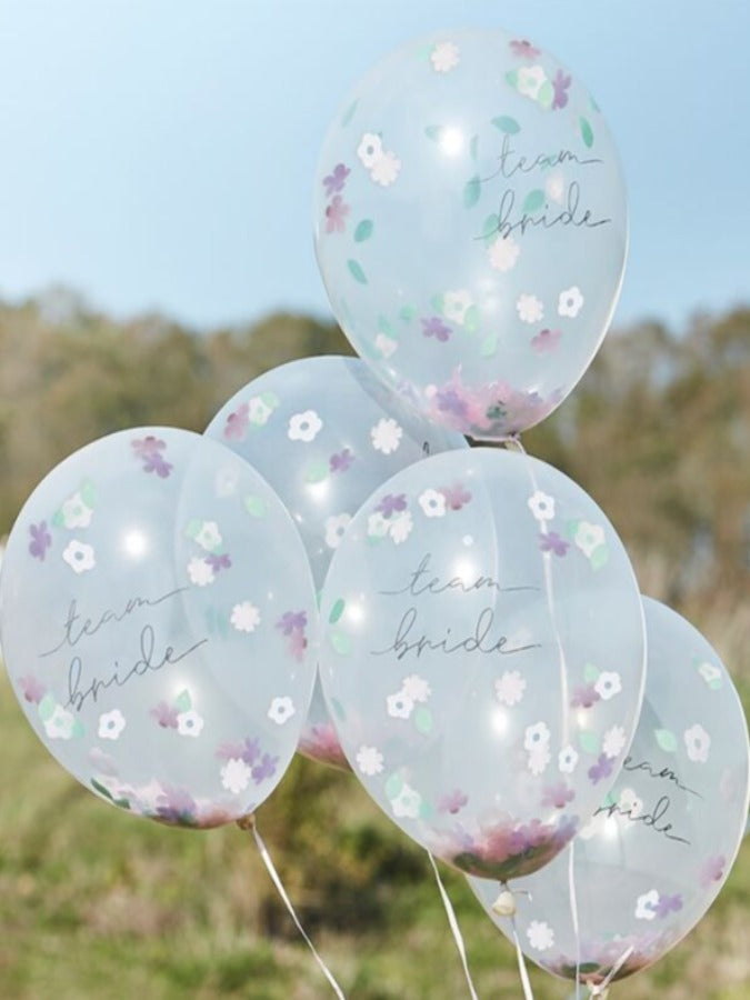 5 floral confetti filled transparent balloons with team bride text